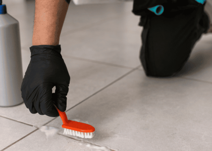 How to clean shower grout with baking soda paste and a grout brush