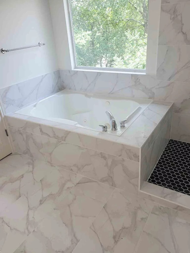 White marble tile bathtub surround remodel, Orlando FL