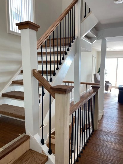Staircase with dark wood handrail and hardwood flooring, Orlando FL