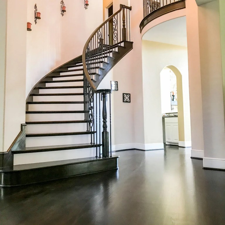 Dark wood curved staircase with white risers, Orlando FL