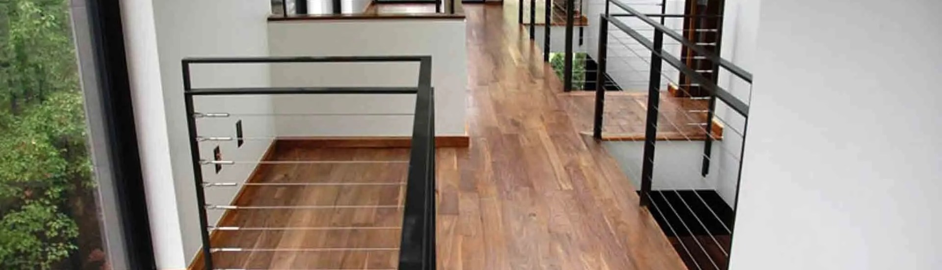 Upstairs hardwood flooring with glass stair railing and natural skylight, Orlando FL