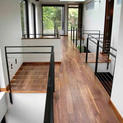 Upstairs hardwood flooring with glass stair railing and natural skylight, Orlando FL